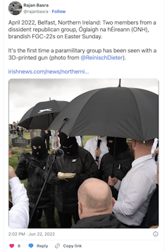 Tweet showing ONH terrorists dressed in black and brandishing 3D-printed guns