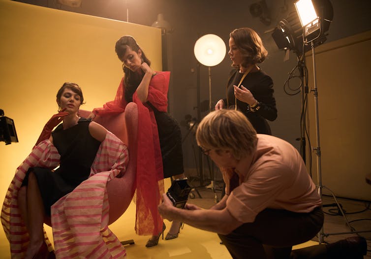 Production image: two models at a fashion shoot.