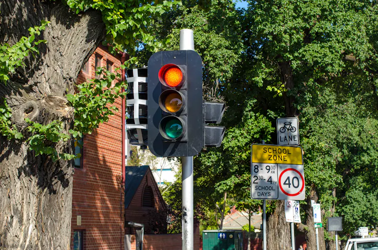 traffic light in street shows red signal