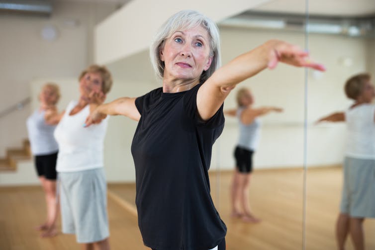 An older woman dancing.