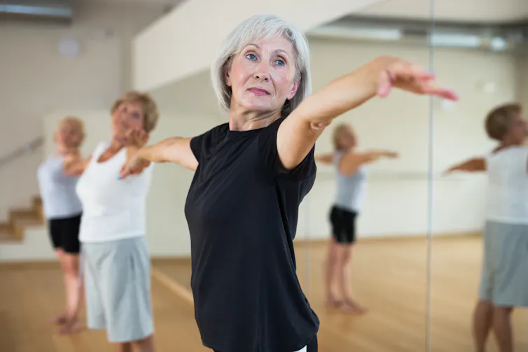 An older woman dancing.