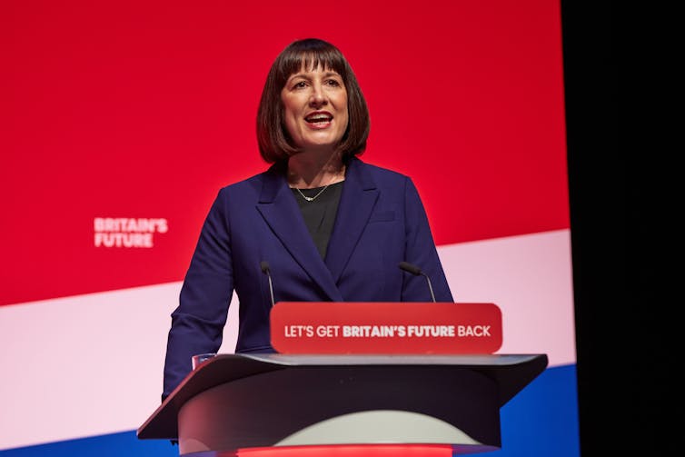 shadow chancellor rachel reeves standing at a podium