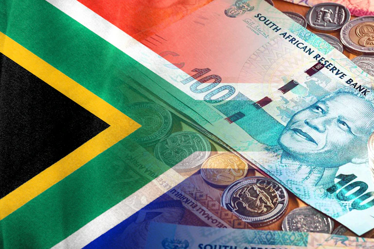 South African flag and South African Rand cash bills and coins