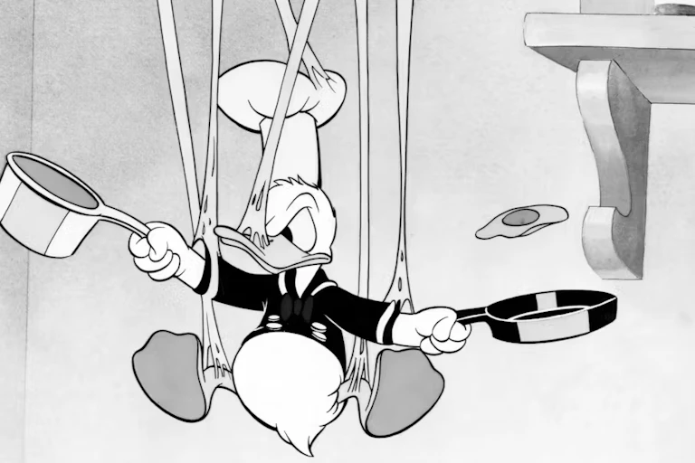 Donald Duck in black and white in a mess while trying to cook.
