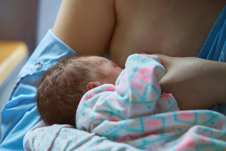 Mother breastfeeding baby