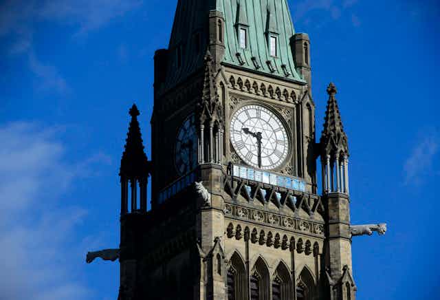 A close up shot of the clock face of a tower