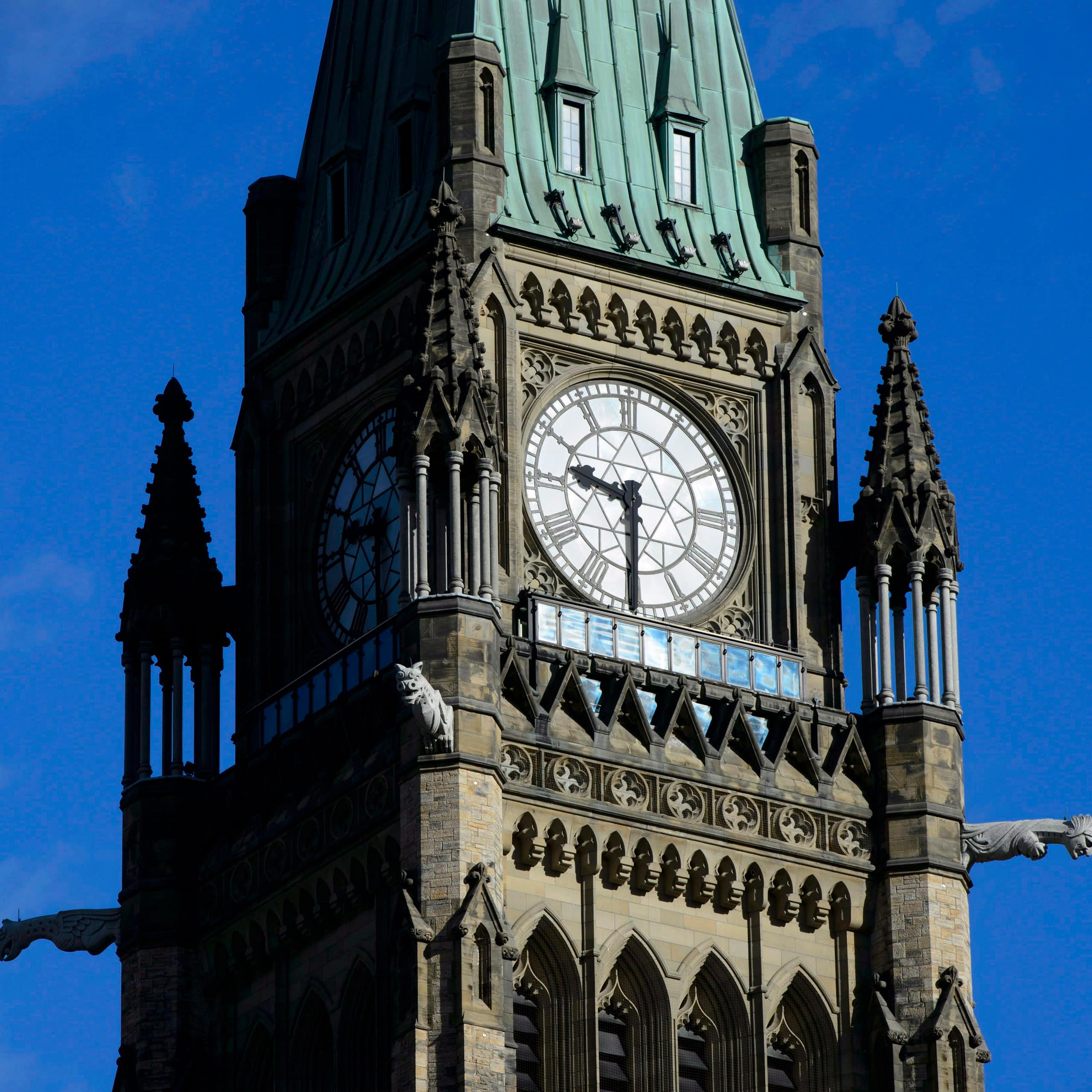 A close up shot of the clock face of a tower