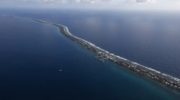 strip of low-lying land surrounded by ocean