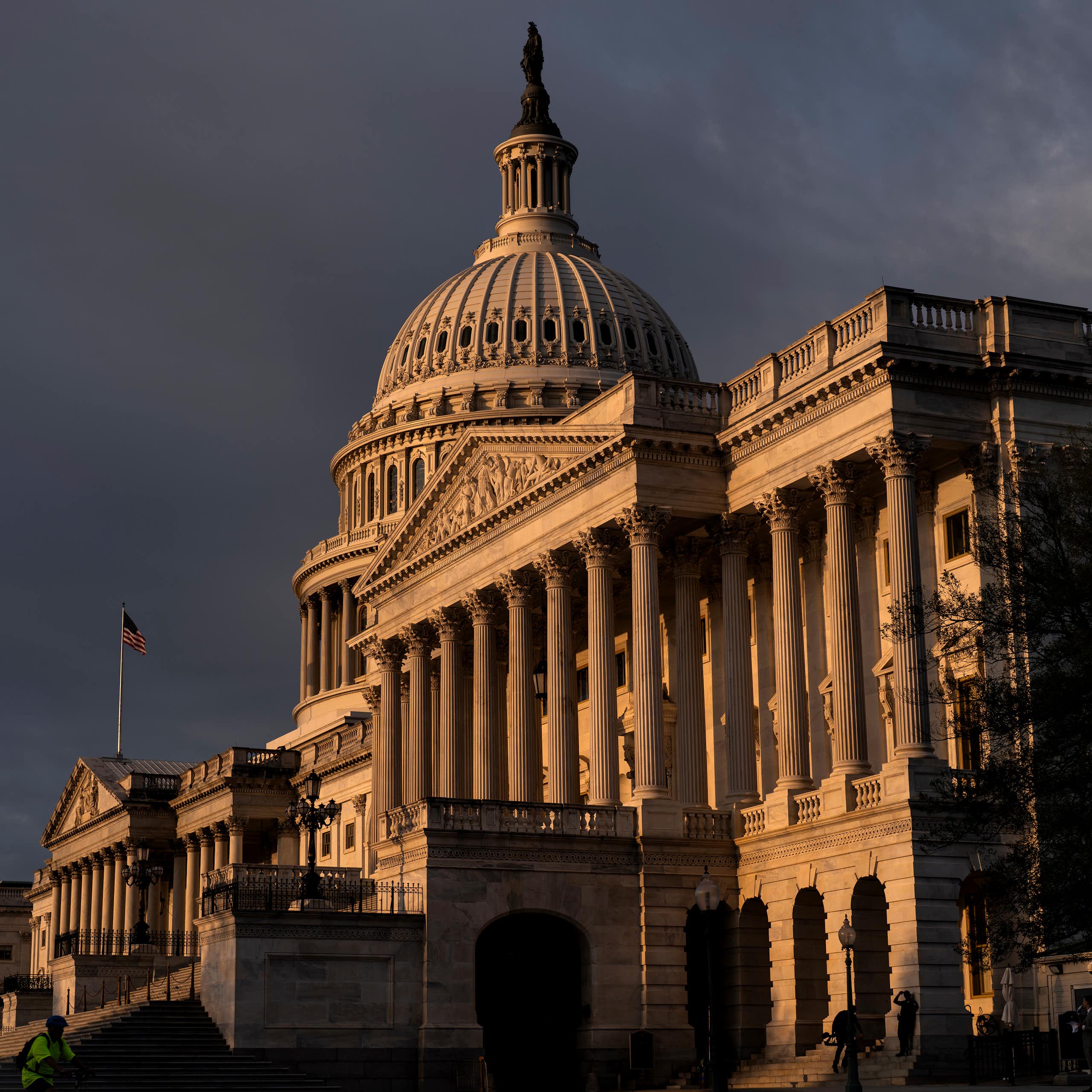 The U.S. Capitol, shown against dark clouds. 