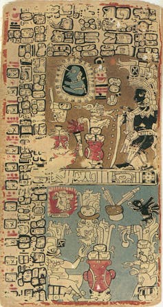 A page covered with hieroglyphs, painted in black, blue and red.