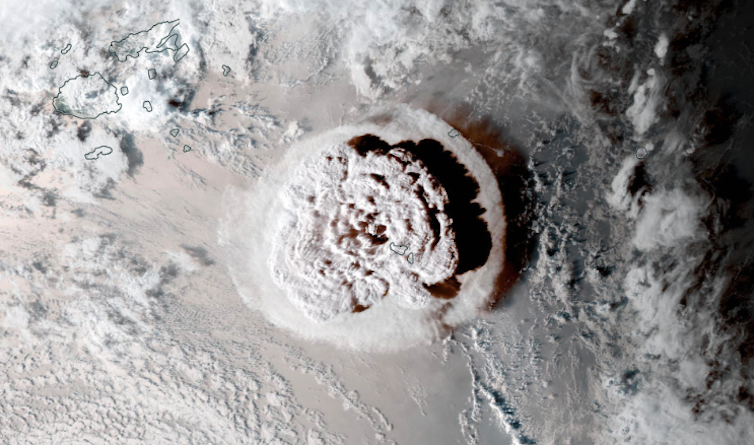 Satellite photo showing a large cloud rising from a volcanic eruption.