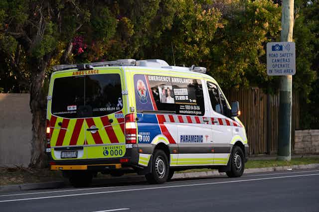An ambulance parked on a street in Melbourne.