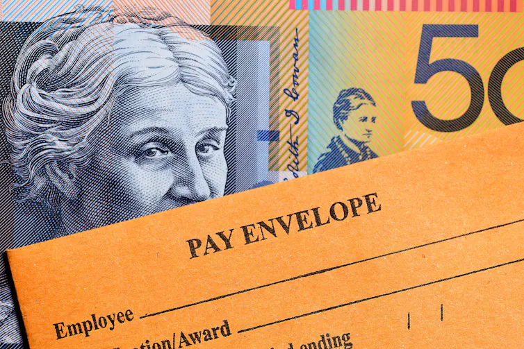 Pay envelope and $50 note