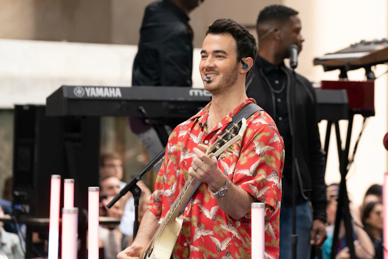 Kevin Jonas performs on stage.