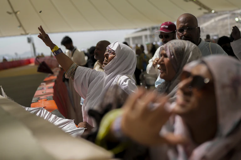 Muslim pilgrims cast stones at pillars