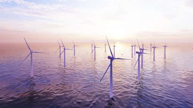 Offshore wind turbines farm on the ocean