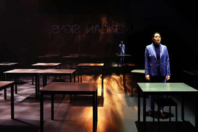 A woman behind a desk