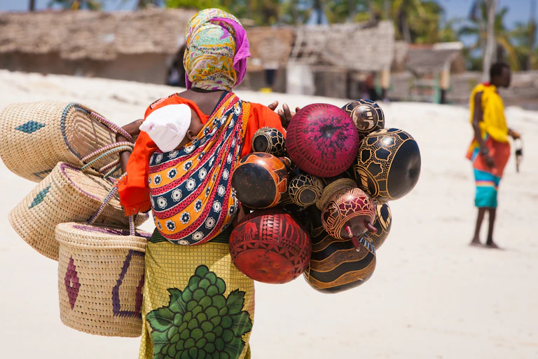 A photo of an African saleswoman with baby on the back