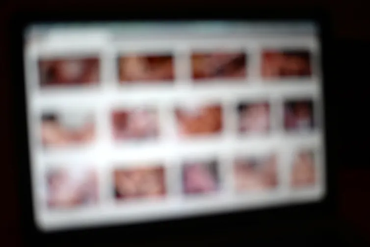 A defocused computer screen with sexually explicit imagery