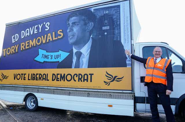 Ed Davey standing next to a can with a picture of Rishi Sunak on its side, with the words 'Ed Davey's Tory Removals'.