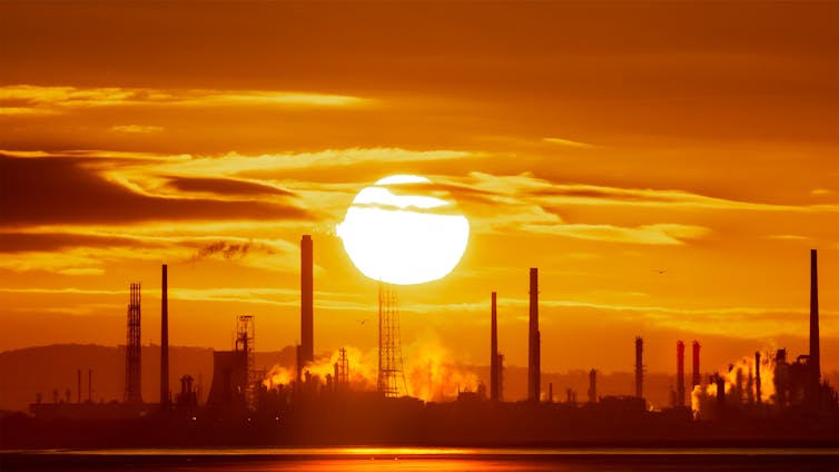 Sunrise over an oil refinery.