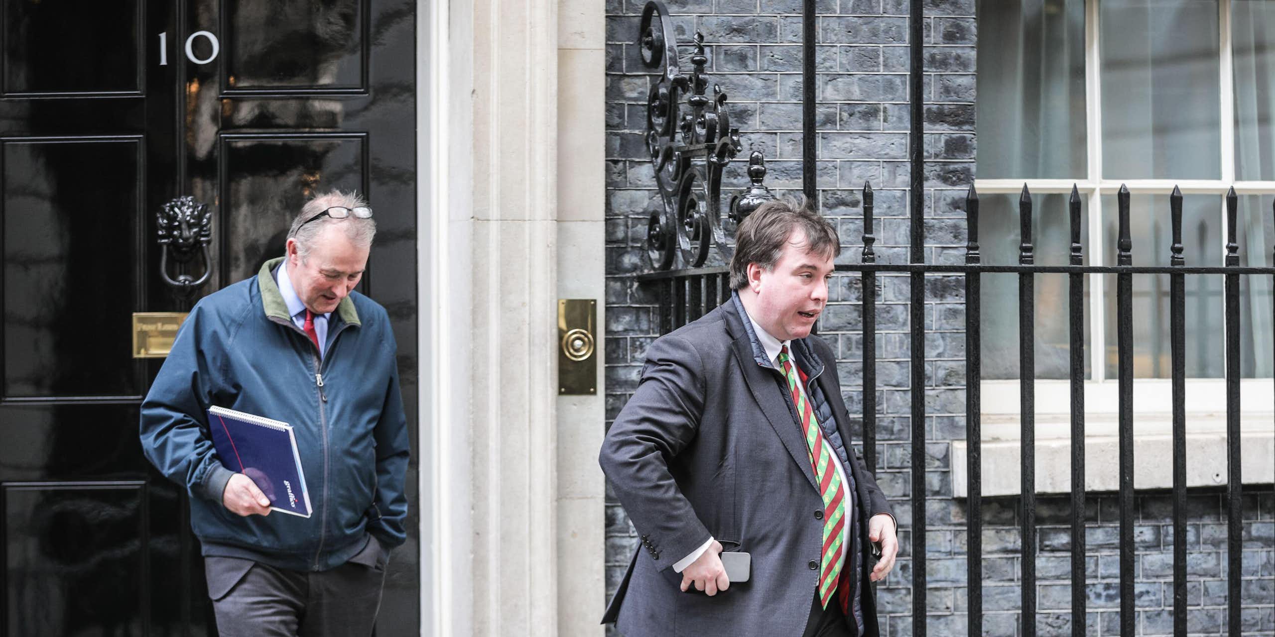 Craig Williams and another man walking out of 10 Downing Street. 