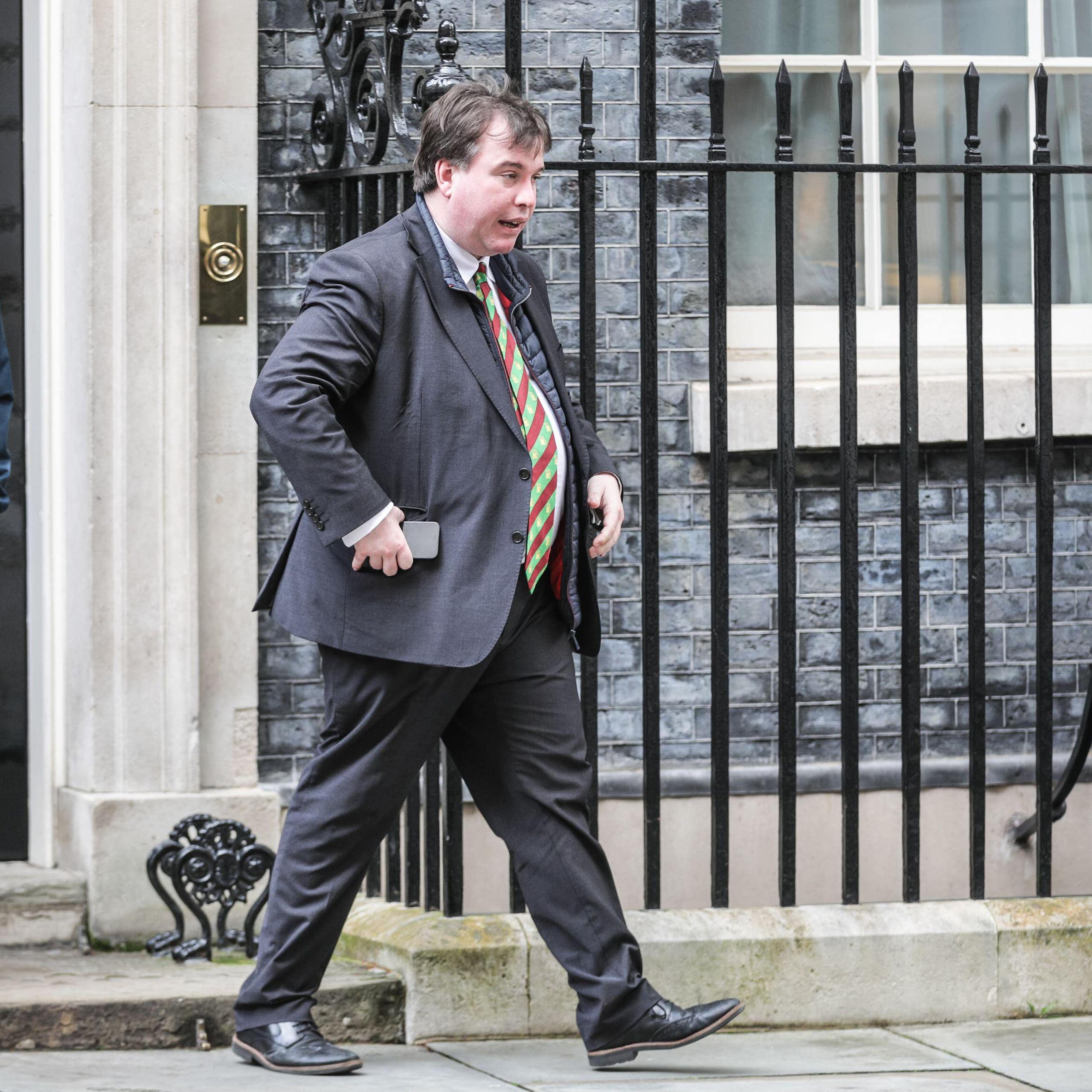 Craig Williams and another man walking out of 10 Downing Street. 