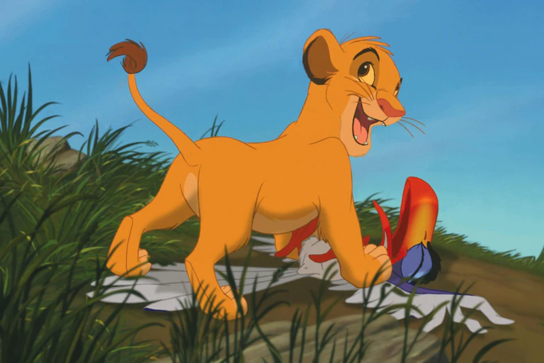 Simba stands on Zazu.