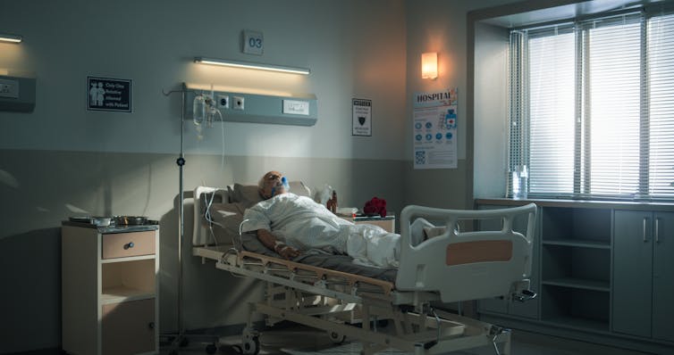 A person in a hospital bed.
