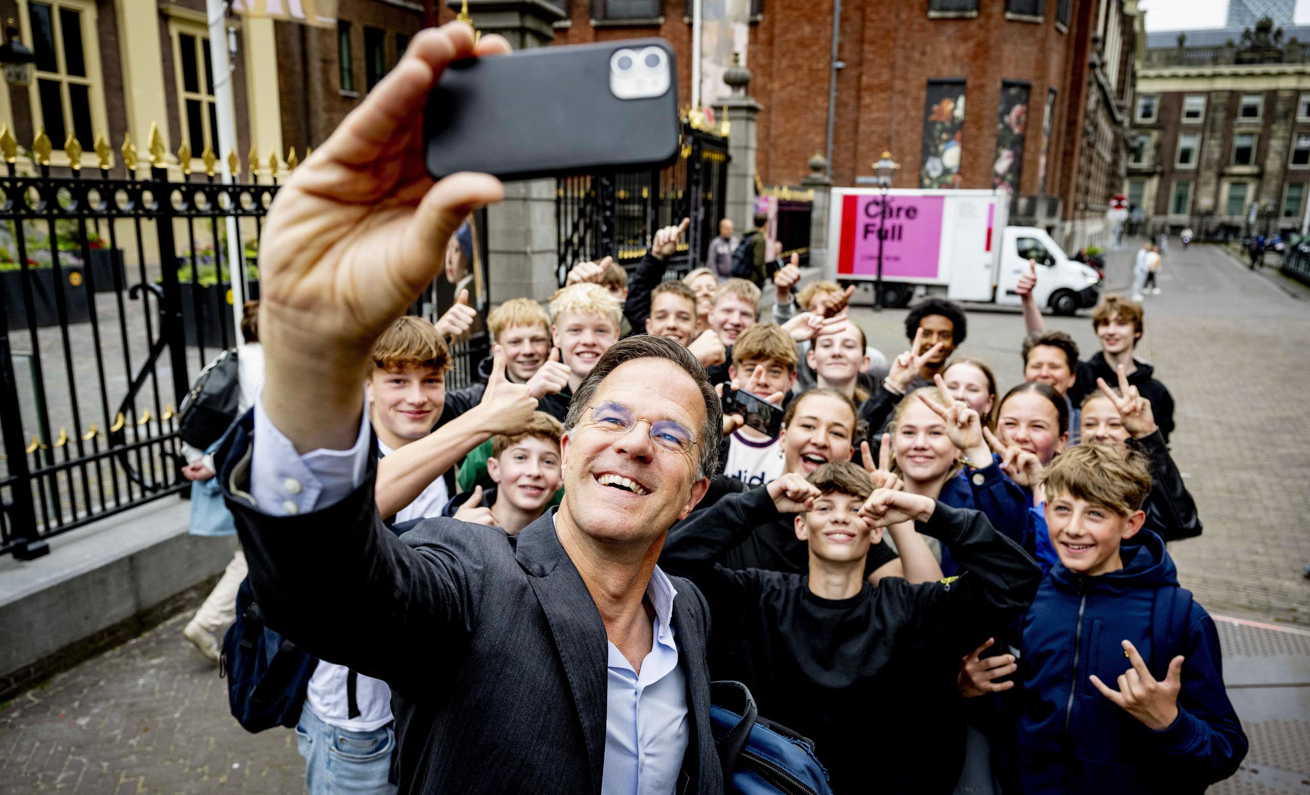 Netherlands prime minister Mark Rutte poses for a selfie with schoolchildren in the Hague, Netherlands, 21 June 2024