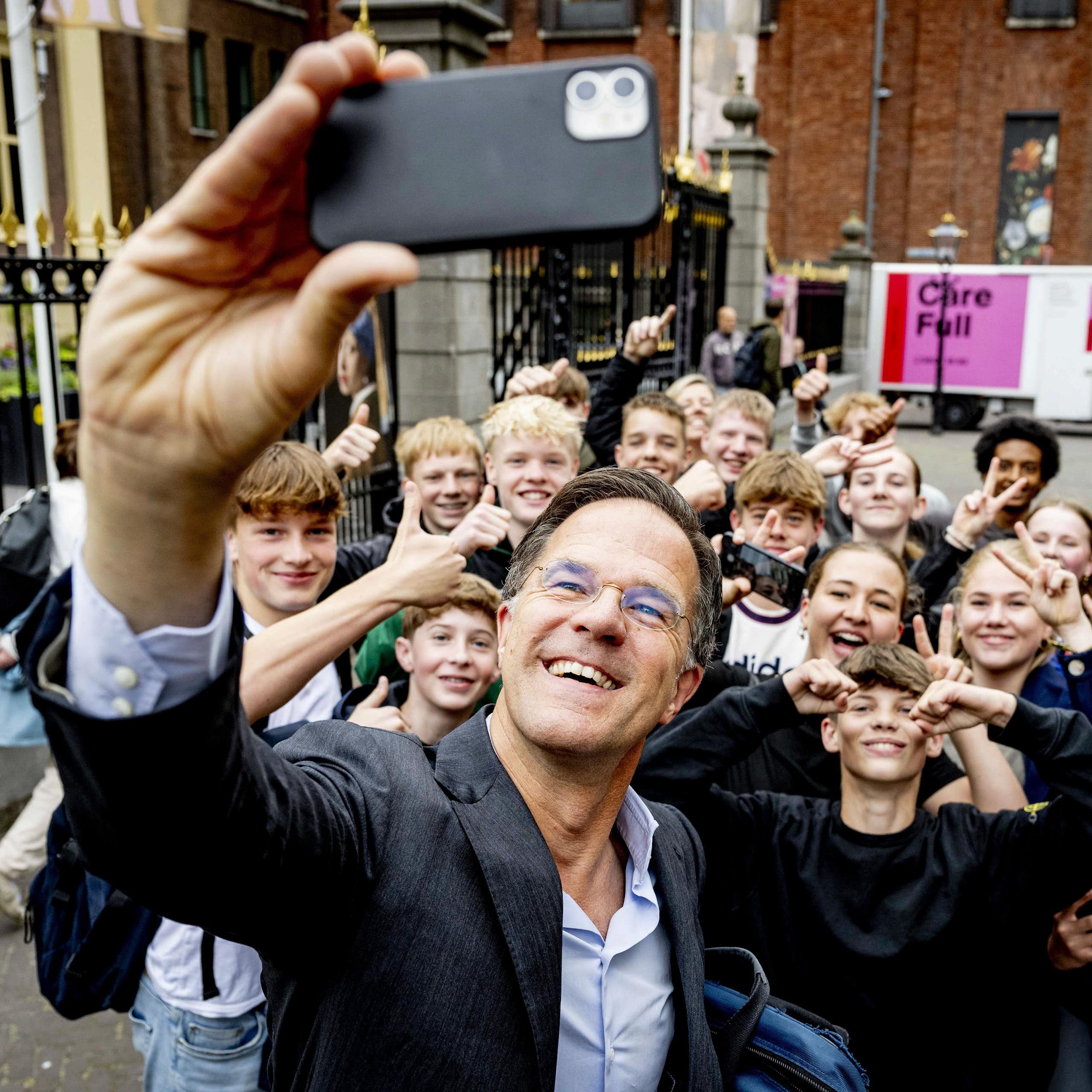Netherlands prime minister Mark Rutte poses for a selfie with schoolchildren in the Hague, Netherlands, 21 June 2024
