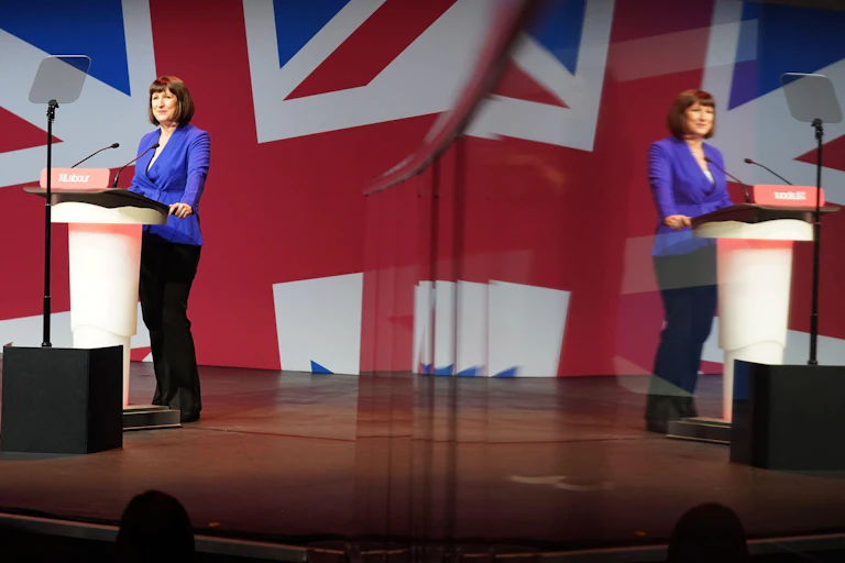 Shadow chancellor Rachel Reeves standing at a podium