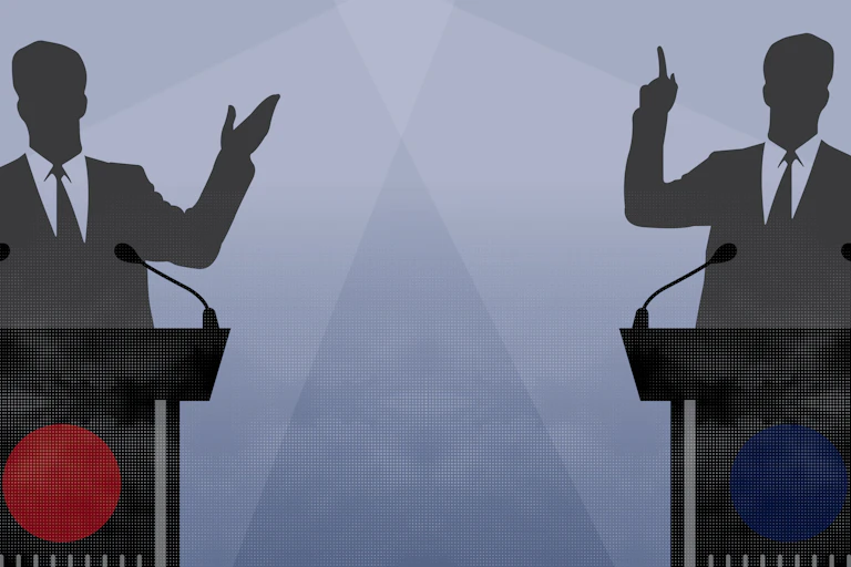 Two figures behind lecterns gesture to an audience.