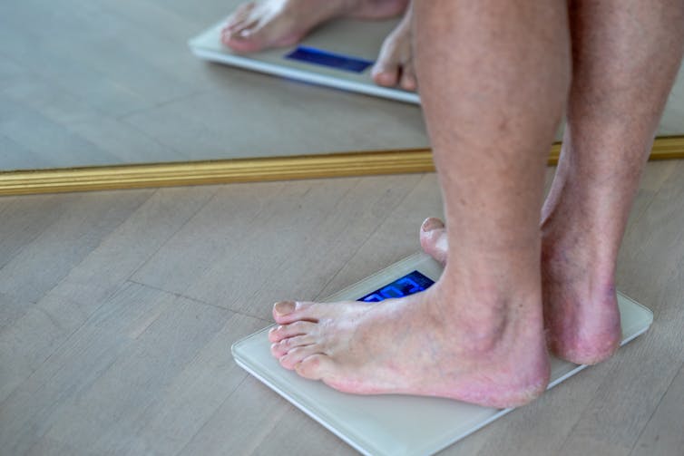Man weighs himself