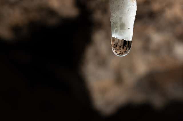water on stalagmite