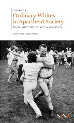 A book cover with a photo of a middle-aged couple in the foreground dancing a traditional Afrikaner dance, other couples in the background on an open field.