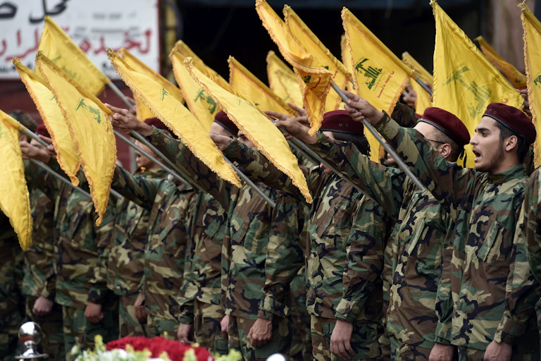 Hezbollah fighters with flags swearing an oath of allegiance, June 2024.