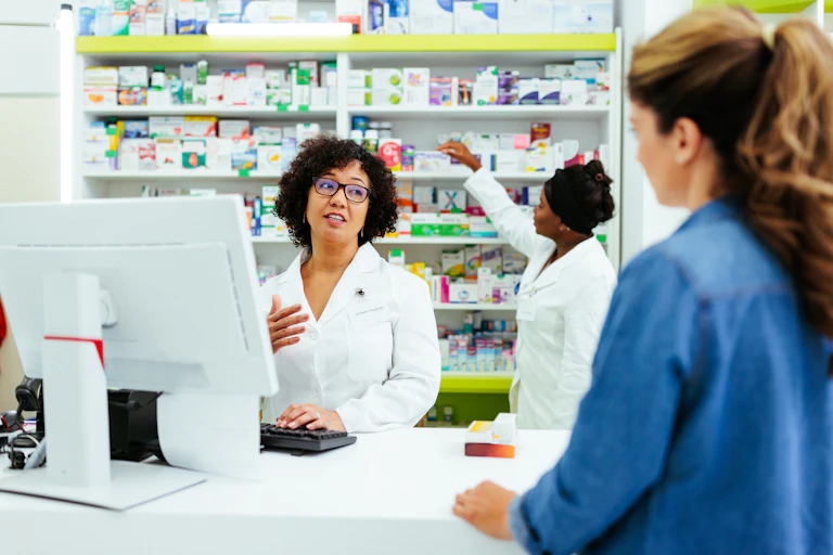 Pharmacist talking to a customer