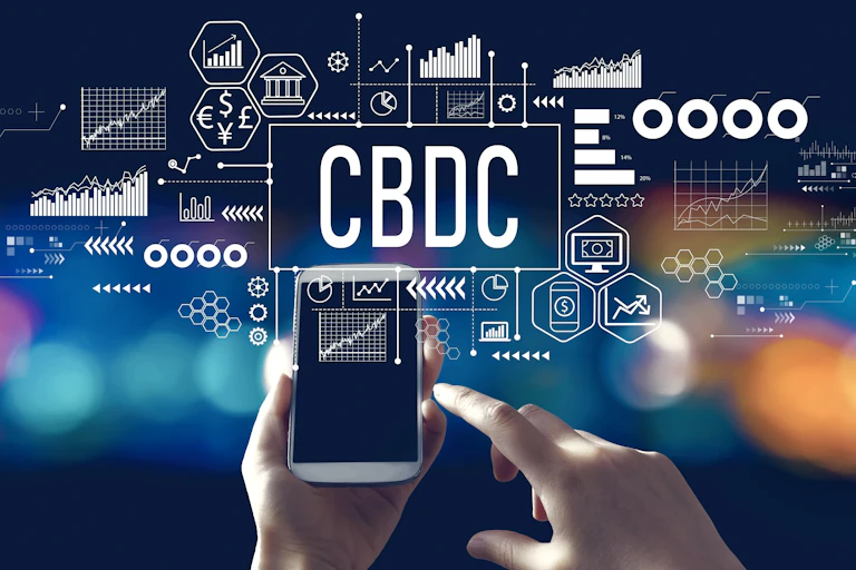 Graphic with digital jargon superimposed on image of a hand holding a mobile phone