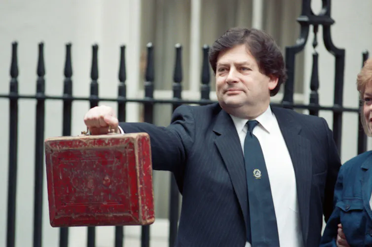 Nigel Lawson with the red briefcase