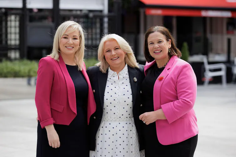 Pat Cullen standing between Sinn Féin Vice President, Michelle O'Neill, and President, Mary Lou McDonald.