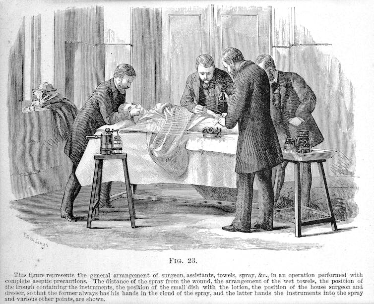 An illustration of doctors working with a patient on a table and a misting device spraying a liquid over the surgical area.