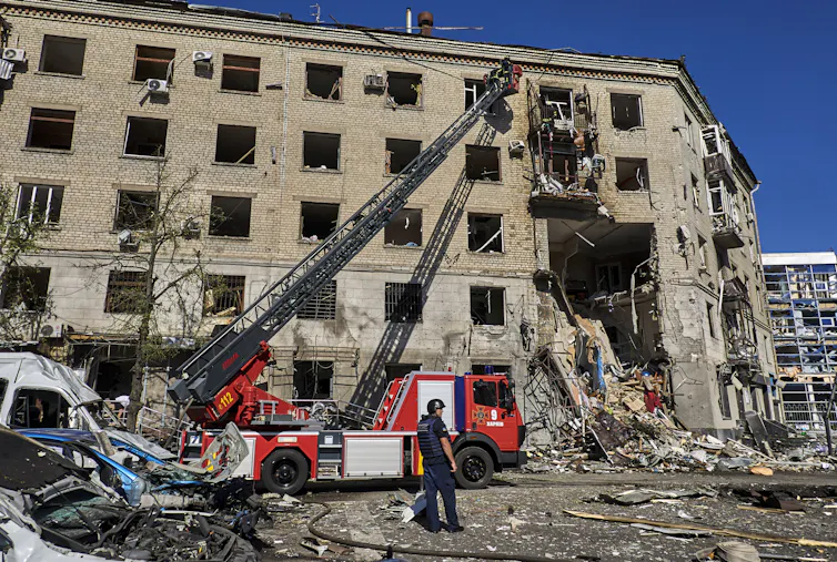 Emergency services at a bombed building.