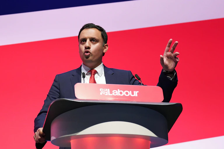 Anas Sarwar speaking at a Labour podium