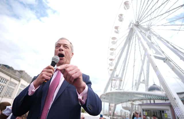 Nigel Farage in front of a ferris wheel in Clacton.