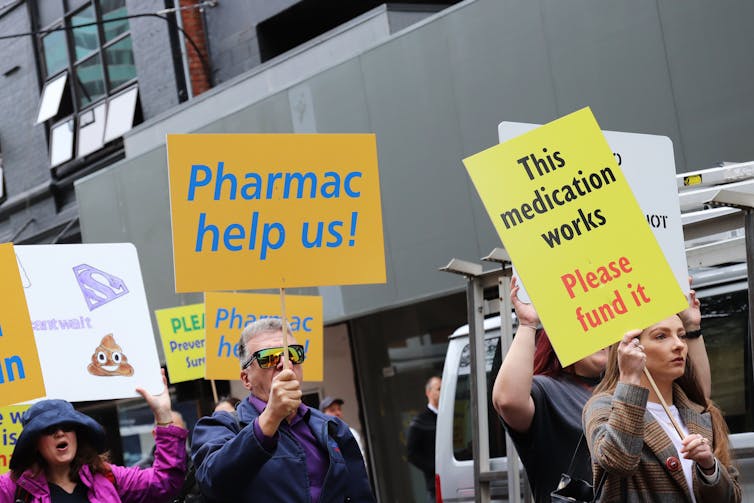 Crohn's and colitis patients and supporters march on the offices of New Zealand's drug buying agency Pharmac