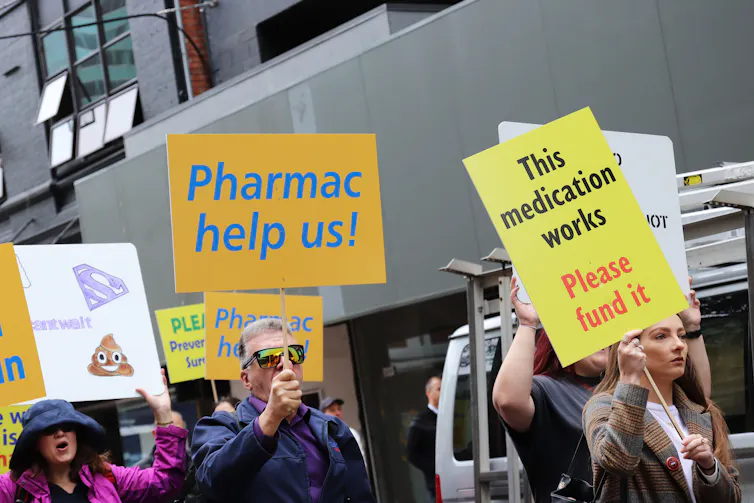 Crohn's and colitis patients and supporters march on the offices of New Zealand's drug buying agency Pharmac