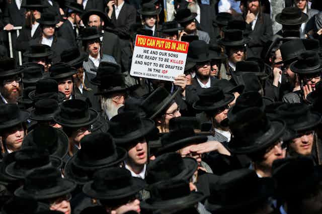 Ultra-Orthodox Haredi Jews march against being conscripted into the IDF, 