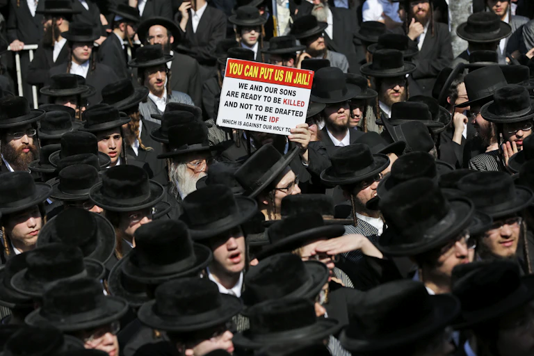 Ultra-Orthodox Haredi Jews march against being conscripted into the IDF,