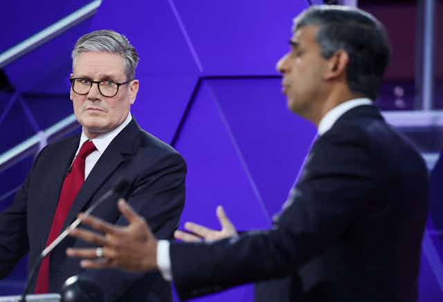 Keir Starmer looks at Rishi Sunak as he answers a question during their final debate.
